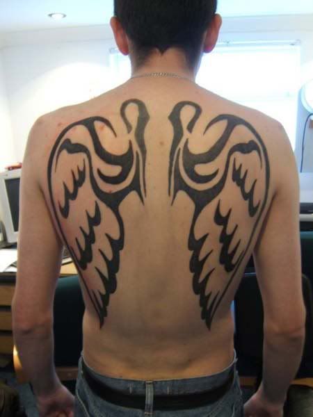 She as the tattoo of angel wings on her back. that look like this